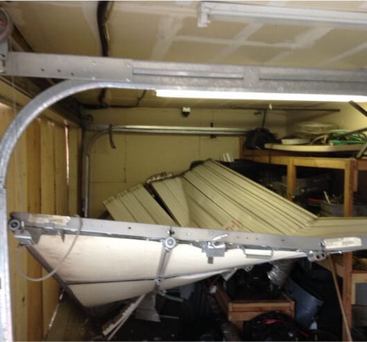 collapsed damaged garage door