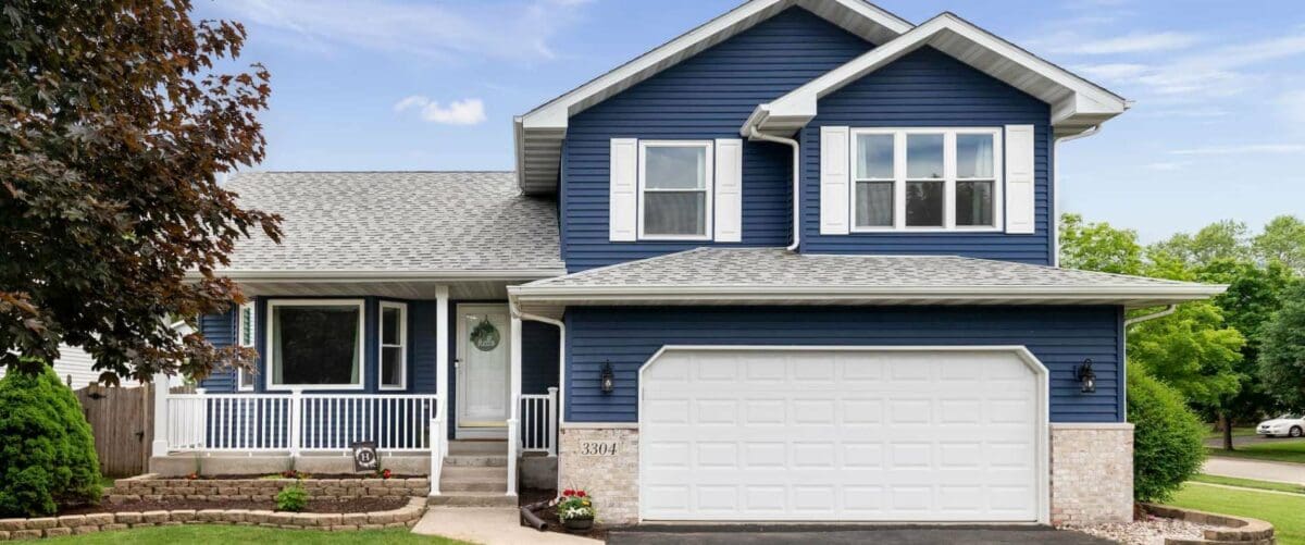 Nice Blue House with garage door