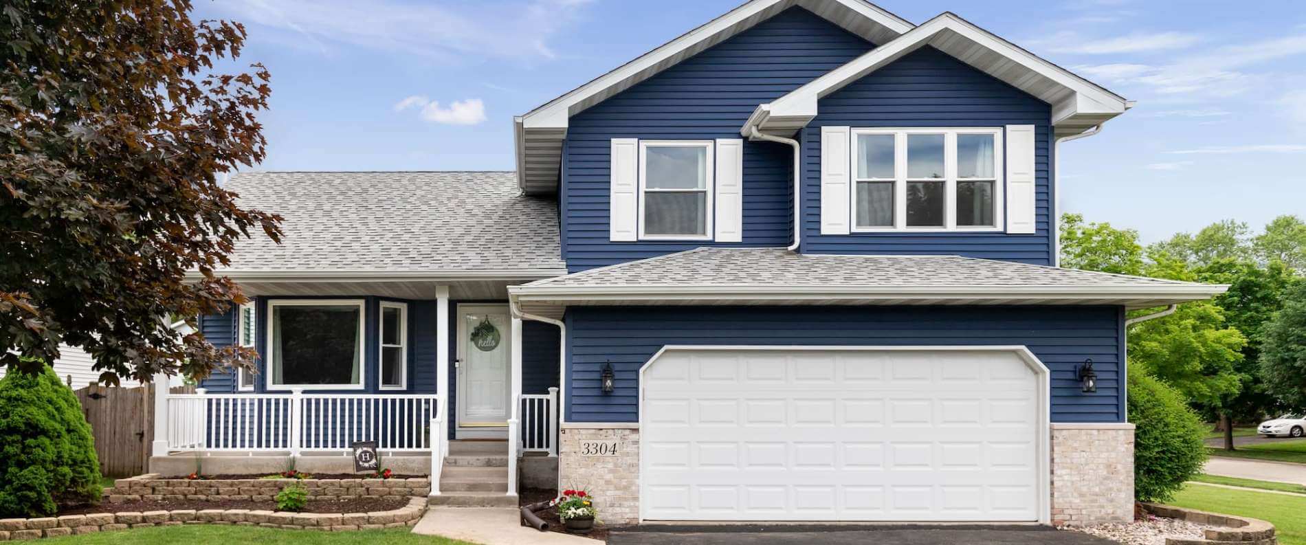 Nice Blue House with garage door
